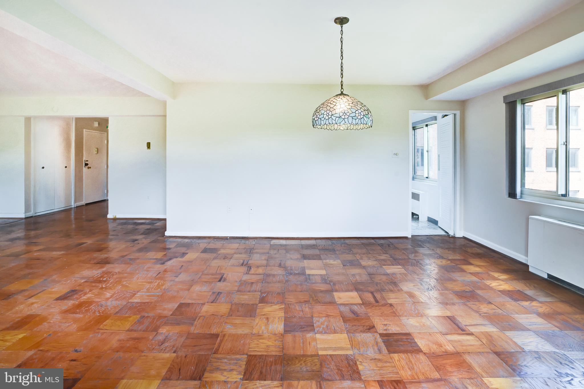 4201 Cathedral Avenue Northwest, Unit 1004E Washington, DC 20016 - Photo 18 of 69 a view of empty room with windows