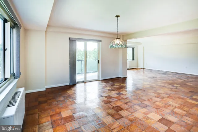 a kitchen with white cabinets and a sink