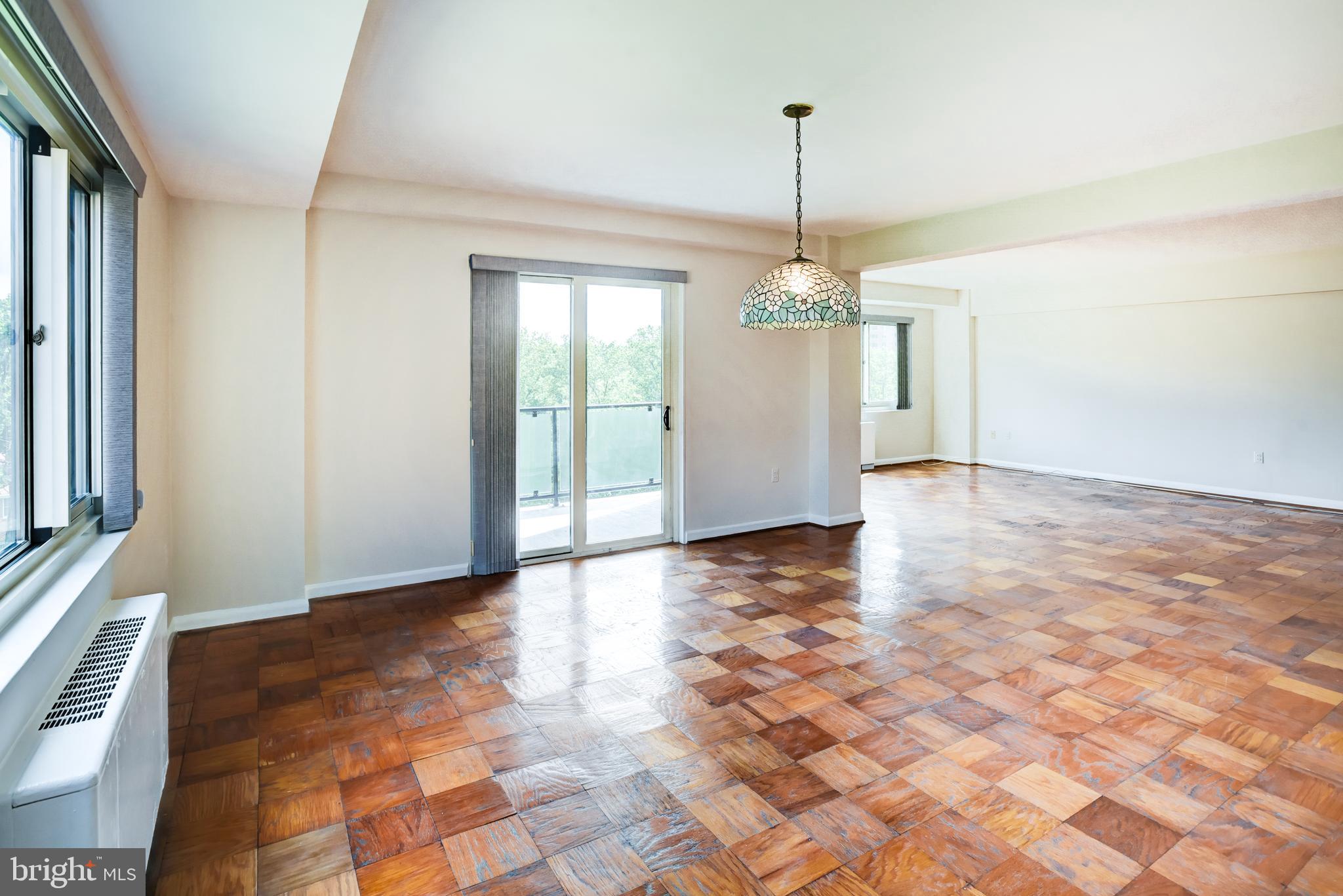 4201 Cathedral Avenue Northwest, Unit 1004E Washington, DC 20016 - Photo 19 of 69 a view of a room with window and chandelier
