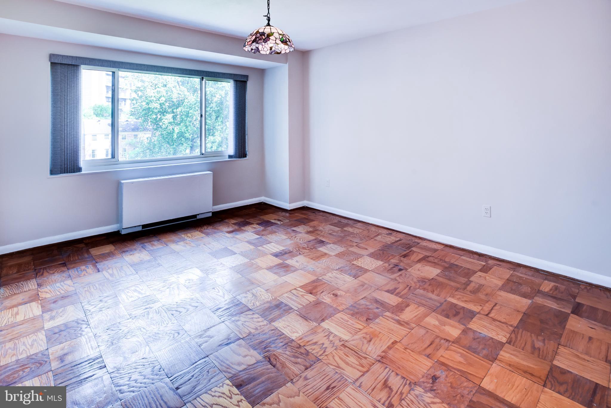 4201 Cathedral Avenue Northwest, Unit 1004E Washington, DC 20016 - Photo 30 of 69 a view of an empty room with a window