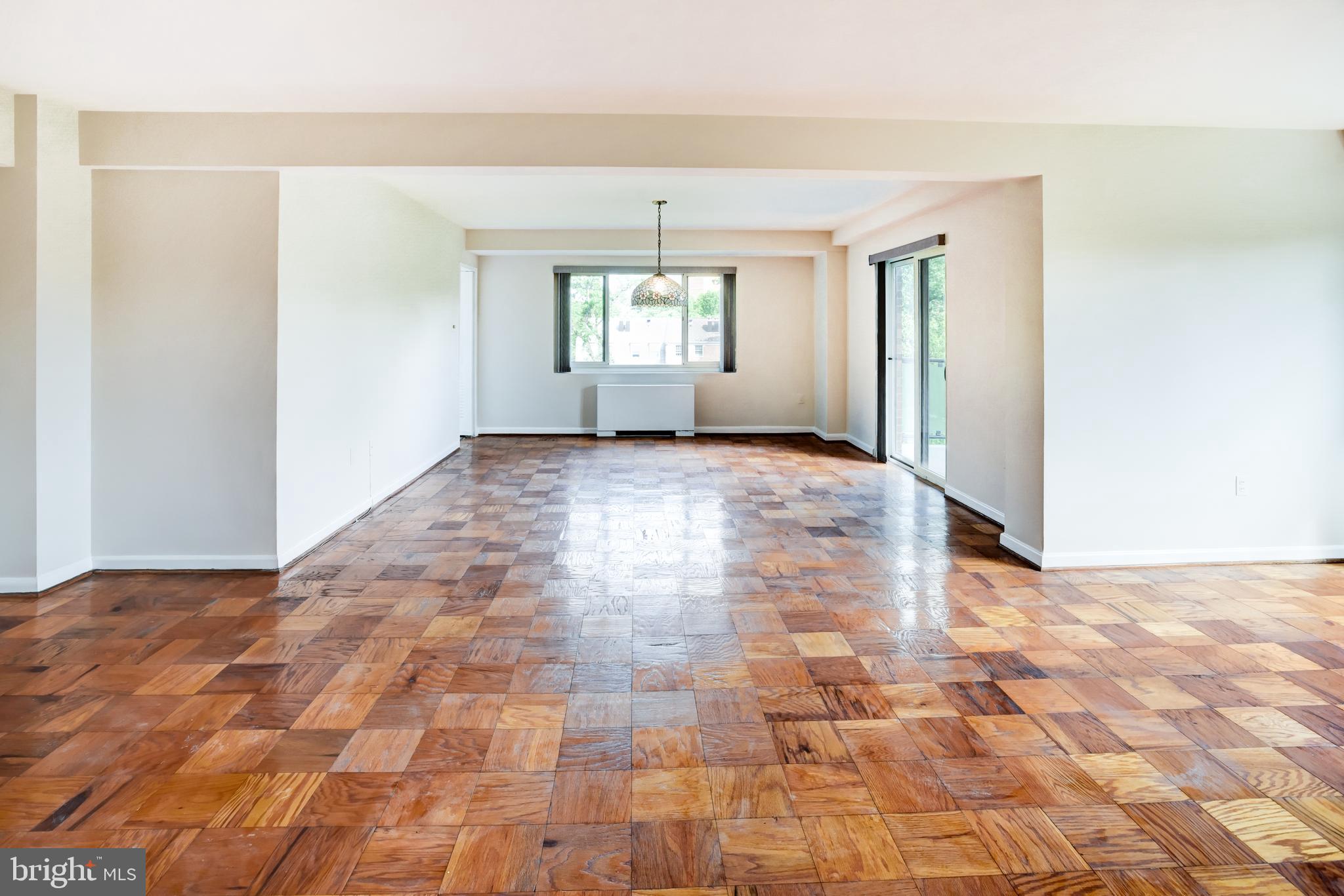 4201 Cathedral Avenue Northwest, Unit 1004E Washington, DC 20016 - Photo 10 of 69 a view of an empty room and window