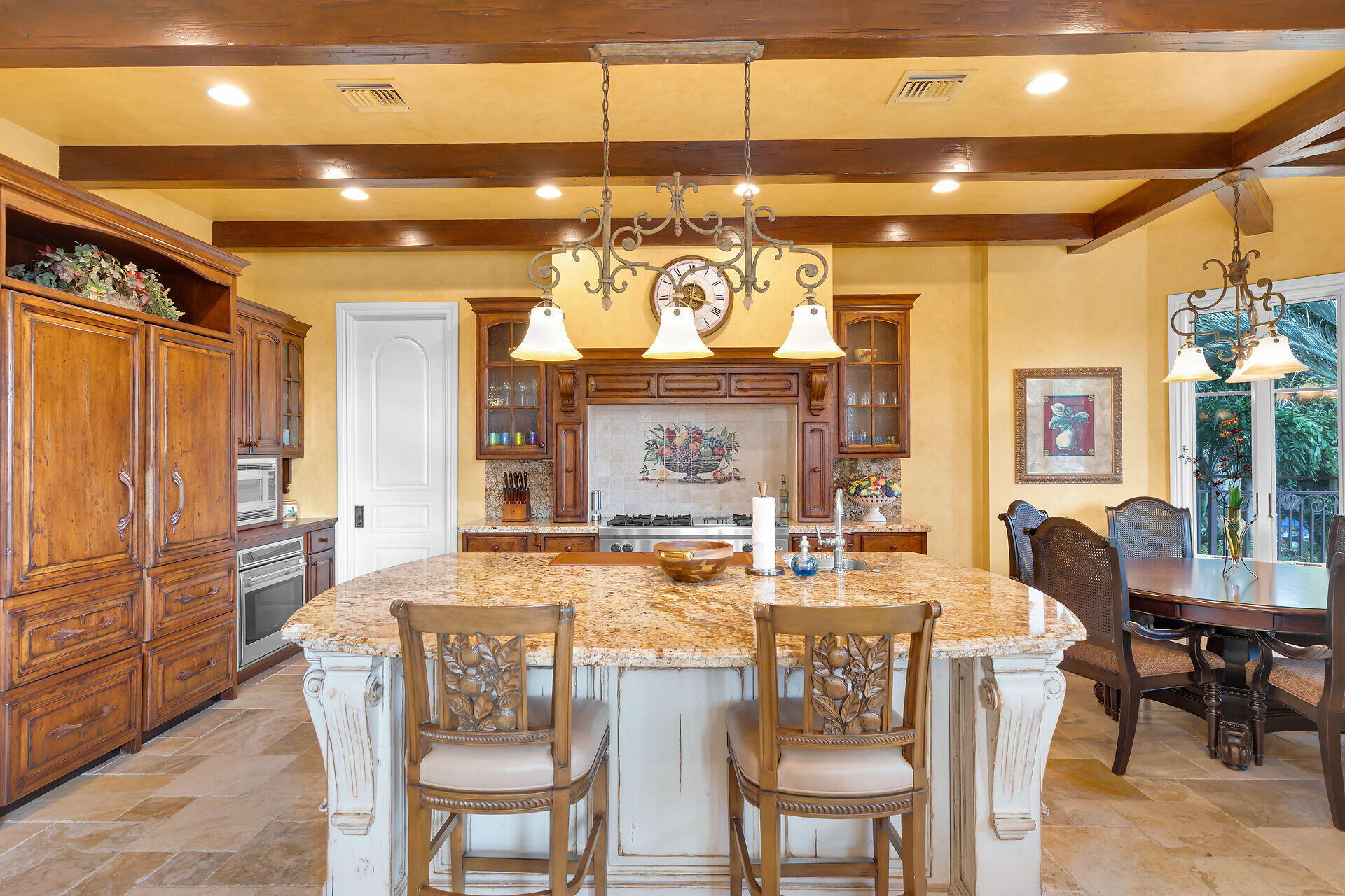 301 Ixora Street Marathon, FL 33050 - Photo 18 of 91 a view of a dining room with furniture a chandelier and large window