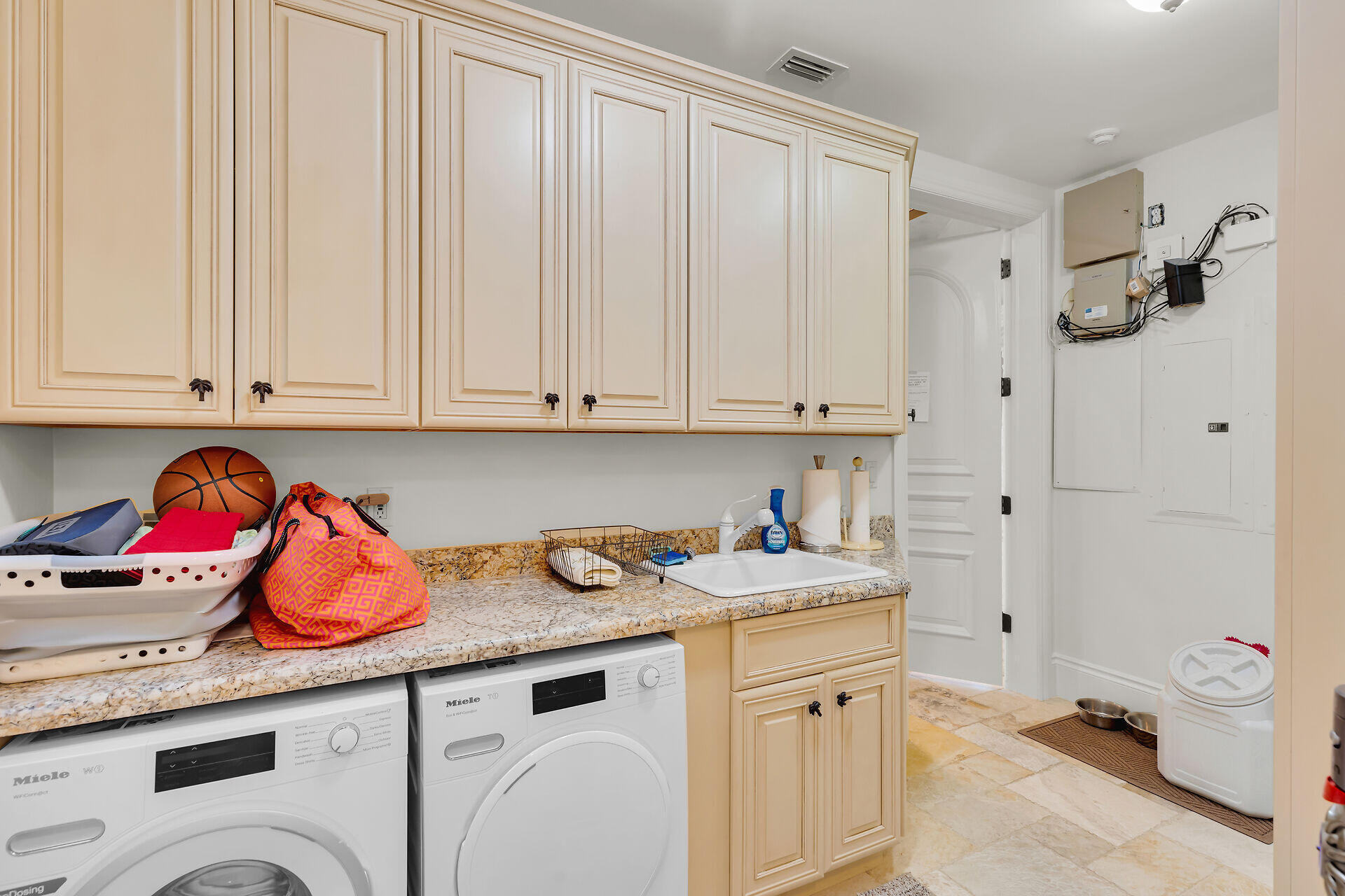 301 Ixora Street Marathon, FL 33050 - Photo 23 of 91 a kitchen with stainless steel appliances granite countertop a sink dishwasher and cabinets with wooden floor