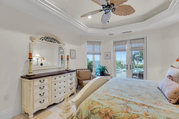 a bed room with a bed and a large window