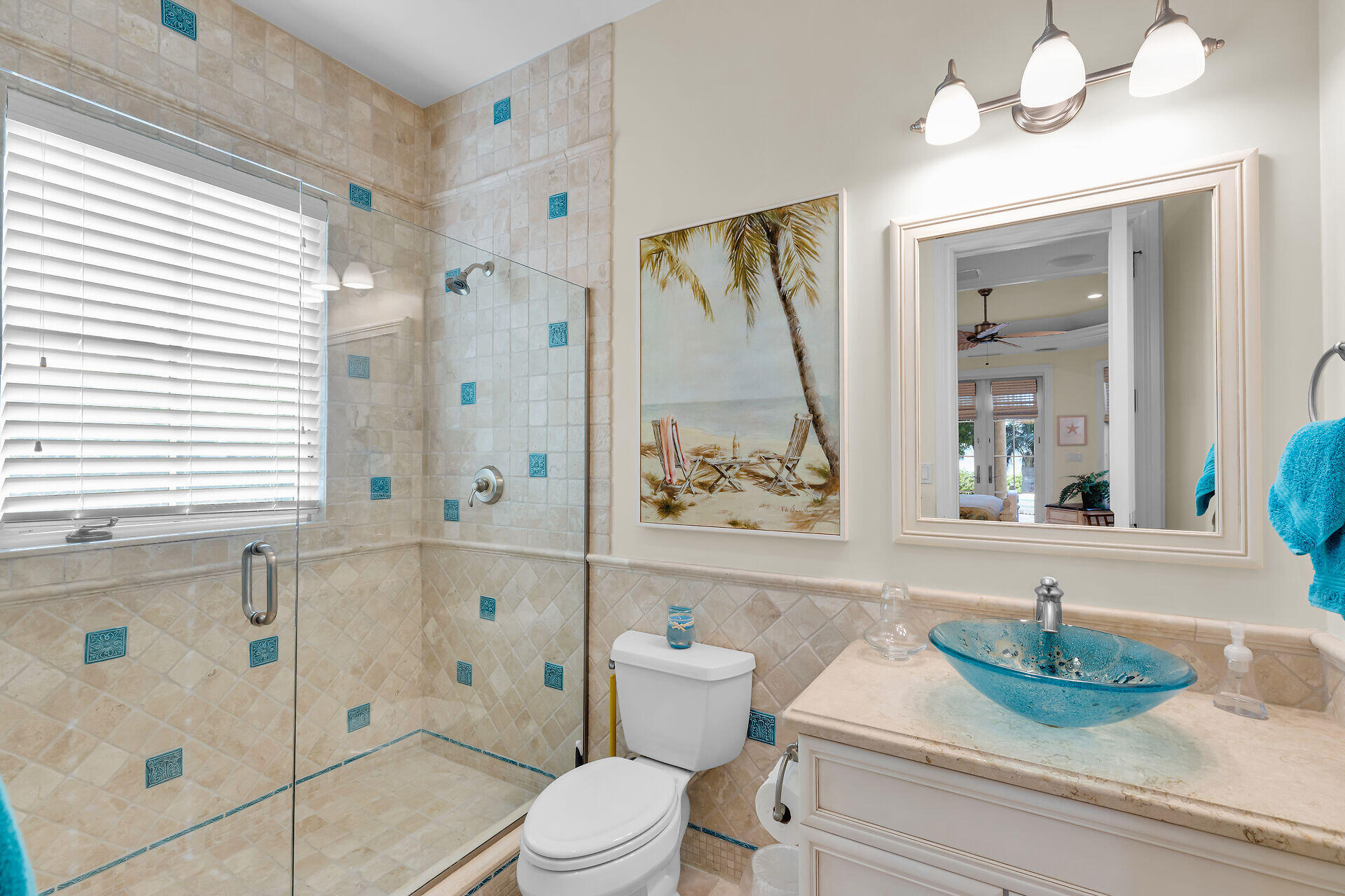 301 Ixora Street Marathon, FL 33050 - Photo 30 of 91 a bathroom with a sink a toilet and a mirror