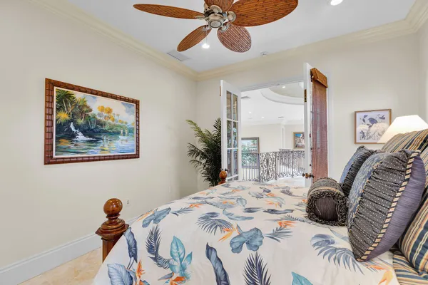 a spacious bedroom with a large bed and a large mirror