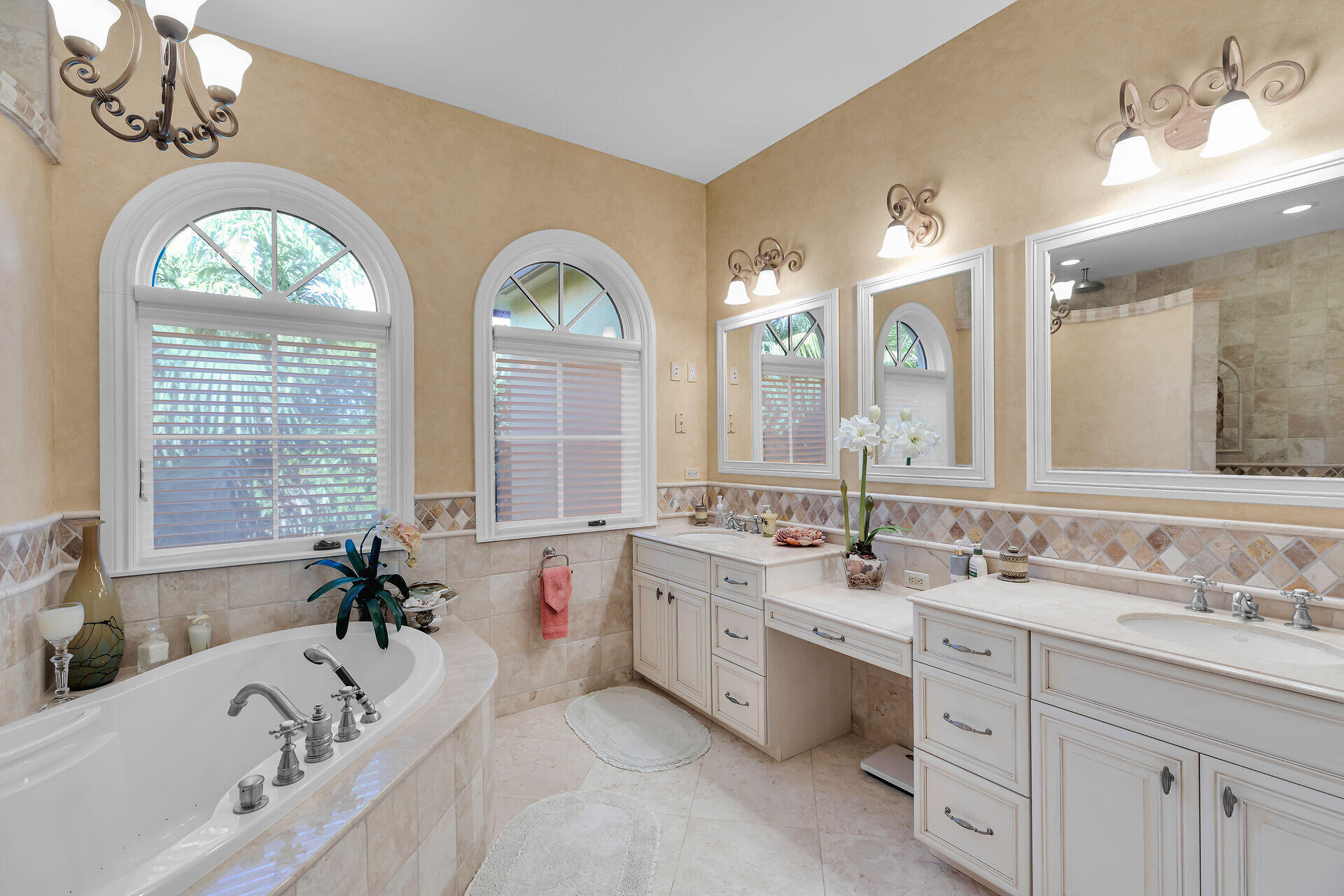 301 Ixora Street Marathon, FL 33050 - Photo 44 of 91 a bathroom with a granite countertop tub a double vanity sink a window and a mirror