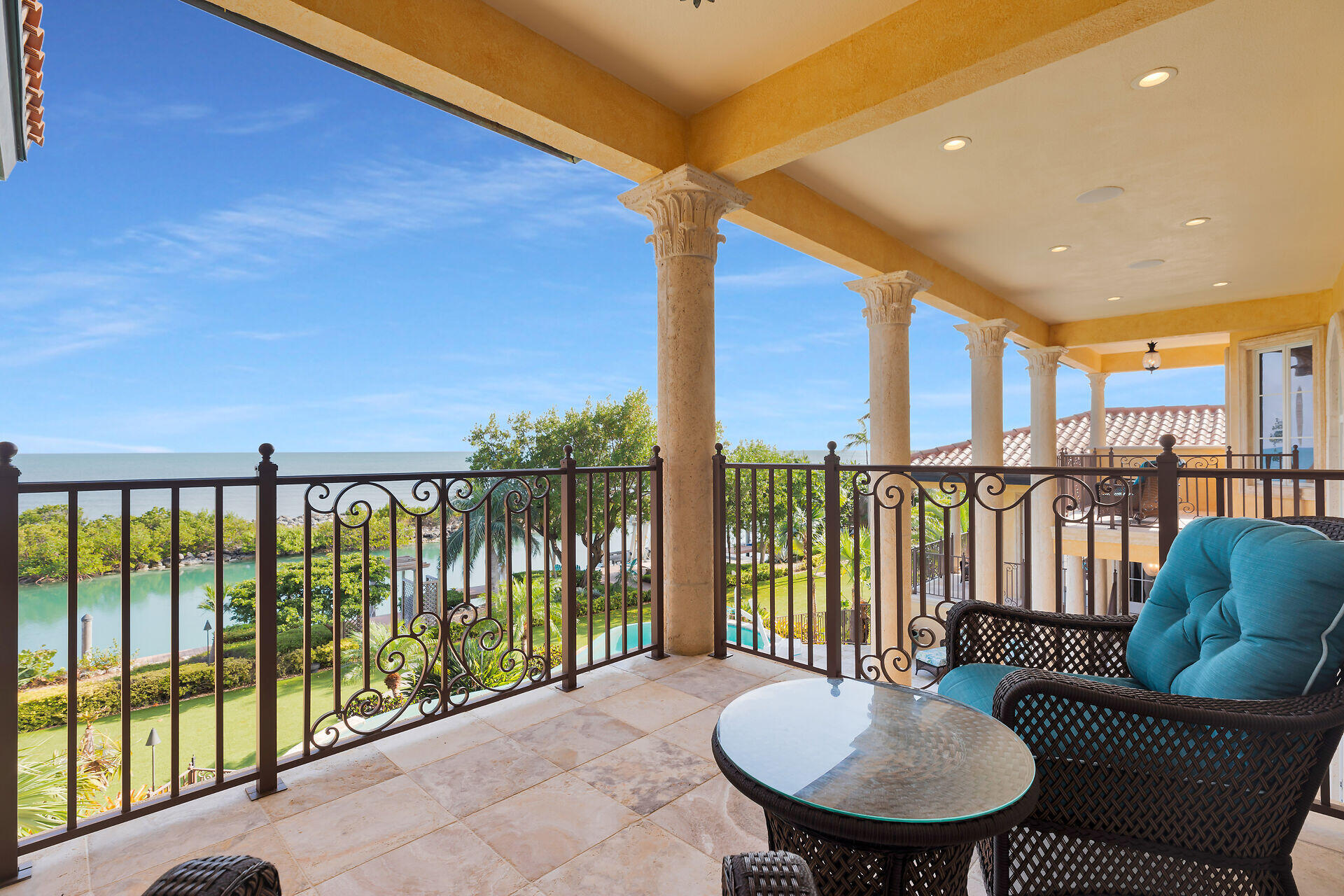 301 Ixora Street Marathon, FL 33050 - Photo 46 of 91 a balcony with table and chairs