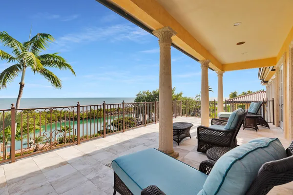 a view of a balcony with chairs