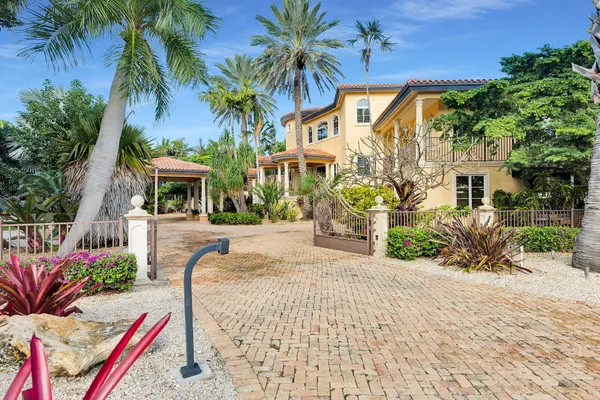 a living room with fireplace furniture and a large window