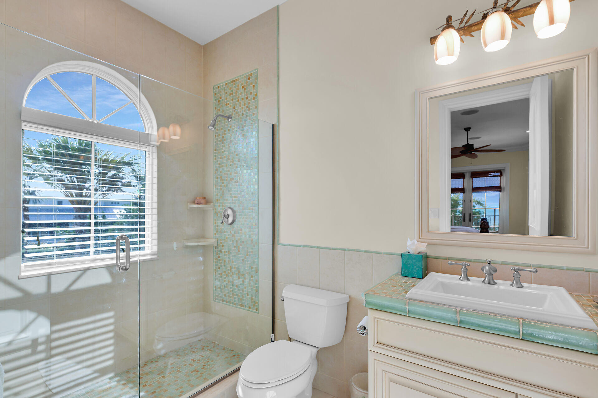 301 Ixora Street Marathon, FL 33050 - Photo 57 of 91 a bathroom with a granite countertop sink vanity mirror and toilet