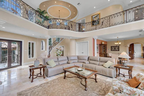 a living room with furniture rug and window