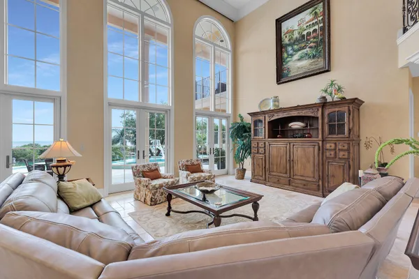 a kitchen with stainless steel appliances a stove a table and chairs with wooden floor