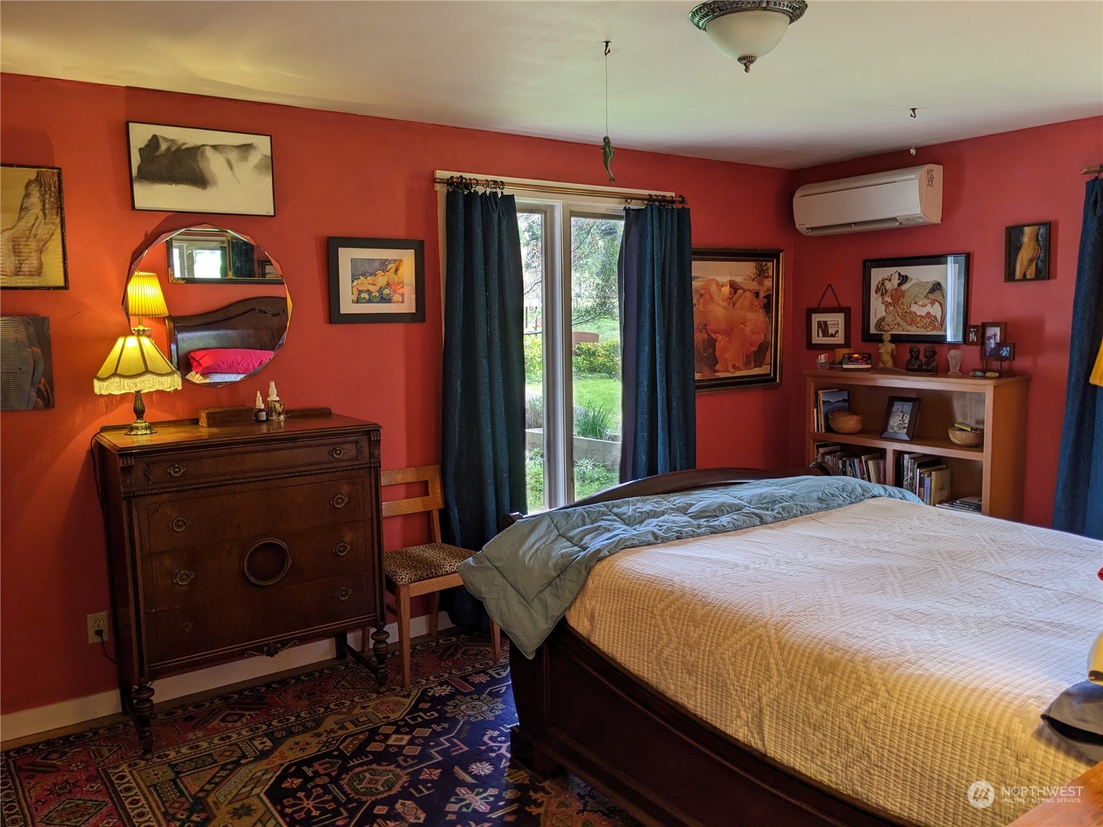 175 Dabob Post Office Road Quilcene, WA 98376 - Photo 14 of 40 a bedroom with a bed and a flat tv screen on dresser