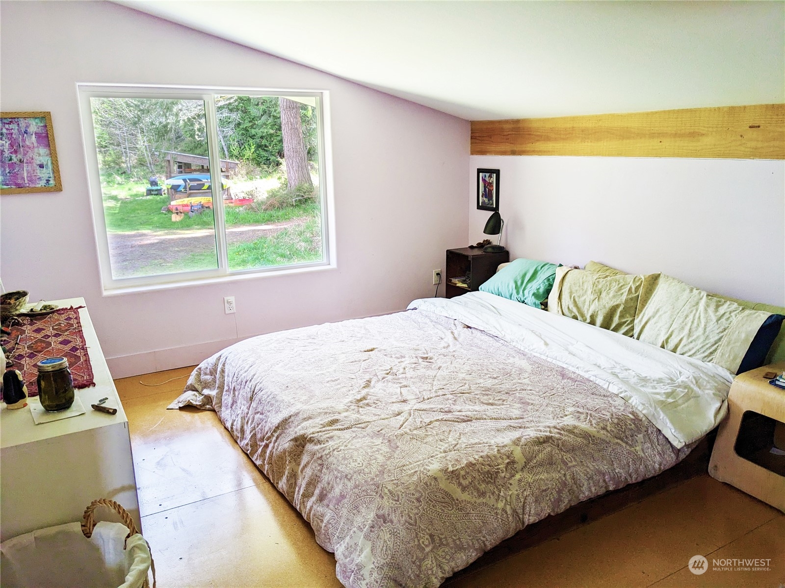175 Dabob Post Office Road Quilcene, WA 98376 - Photo 21 of 40 a bed sitting in a bedroom next to a window
