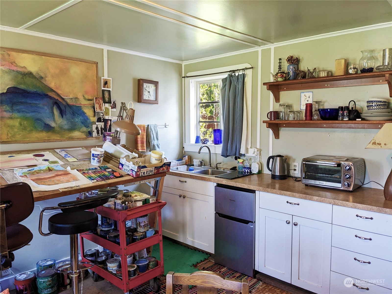 175 Dabob Post Office Road Quilcene, WA 98376 - Photo 25 of 40 a kitchen with granite countertop lots of clutter and stainless steel appliances