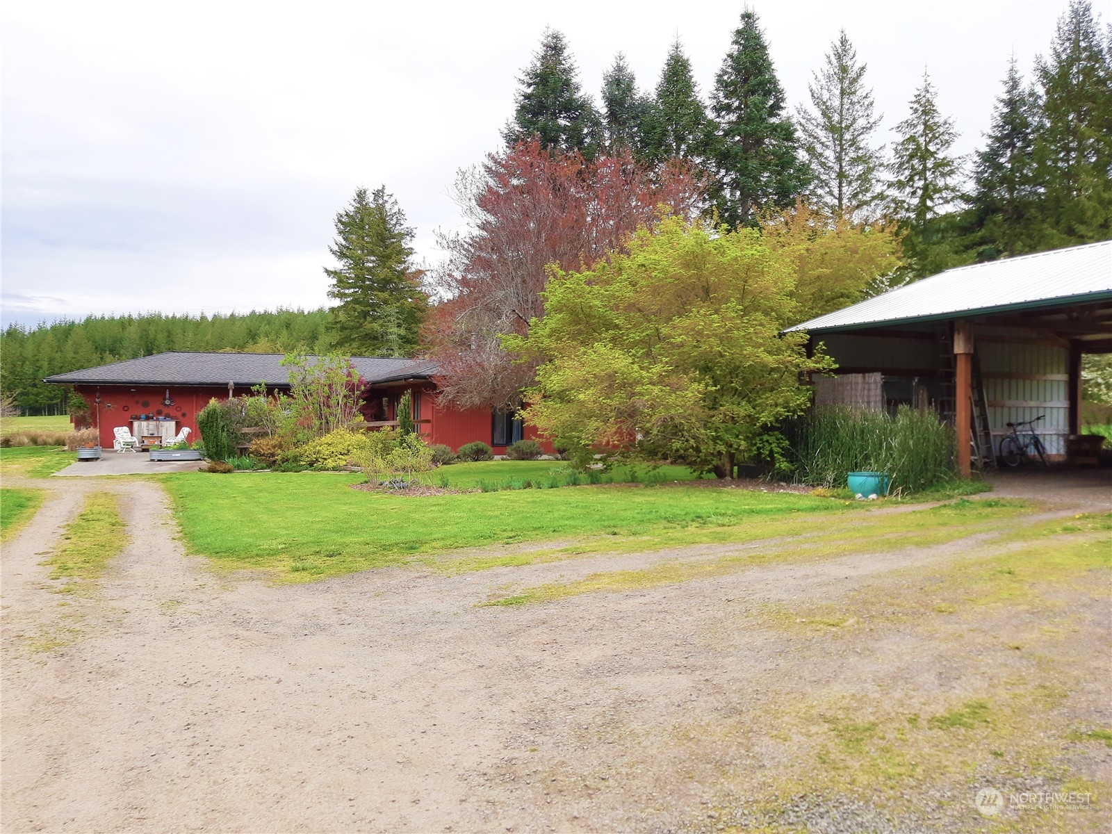 175 Dabob Post Office Road Quilcene, WA 98376 - Photo 3 of 40 a front view of house with yard and green space