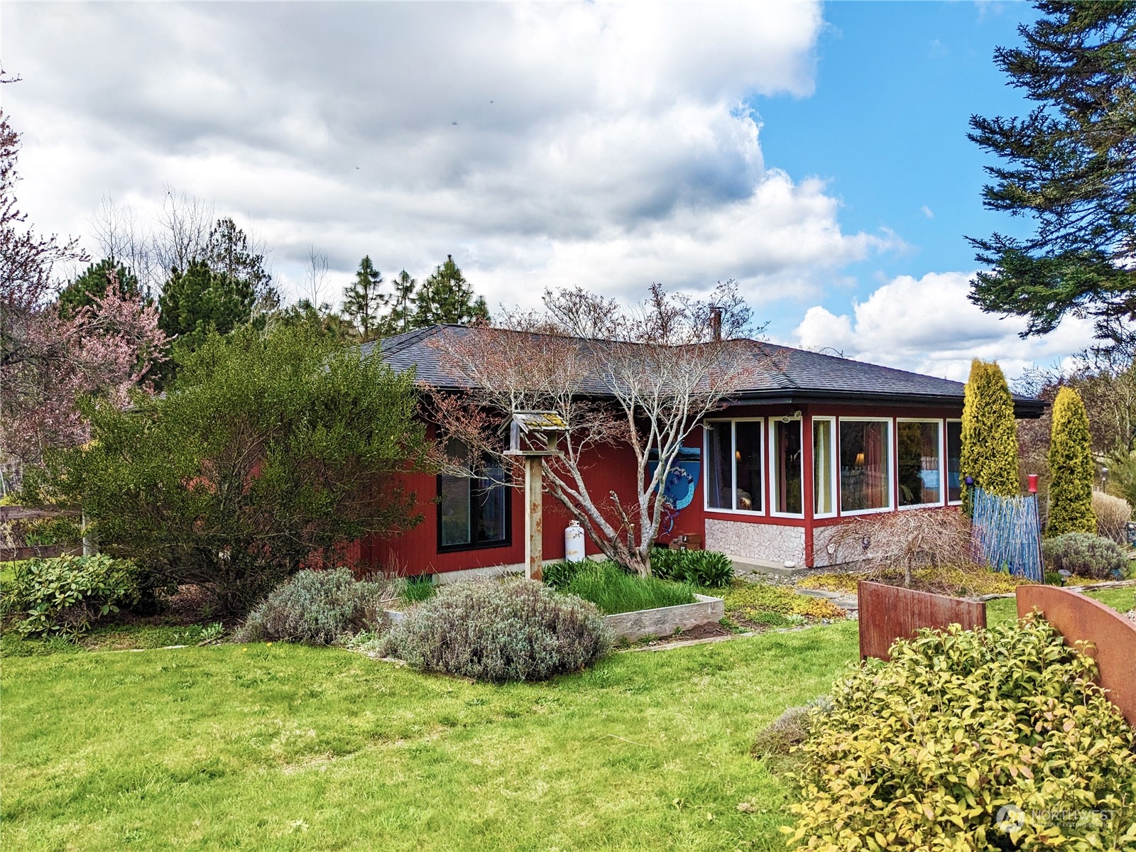 175 Dabob Post Office Road Quilcene, WA 98376 - Photo 4 of 40 a front view of a house with garden