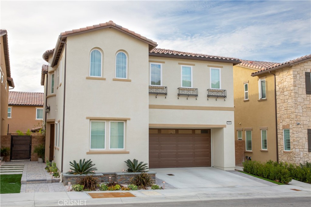 a front view of a house with yard