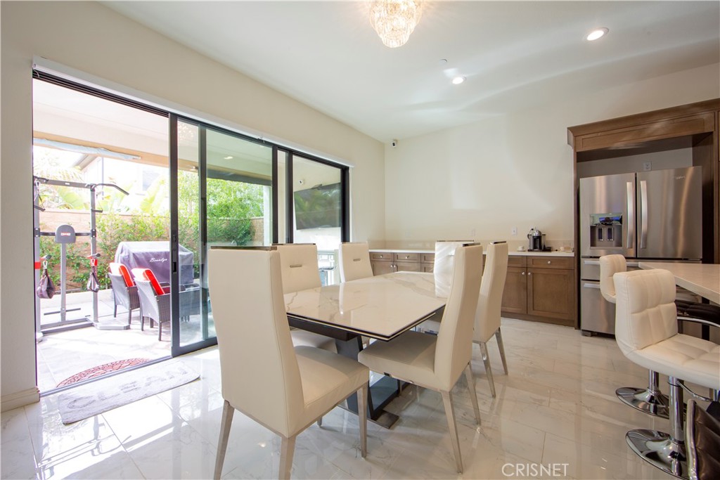 20800 Pine Cone Circle Porter Ranch, CA 91326 - Photo 12 of 43 a view of a dining room with furniture window and outside view