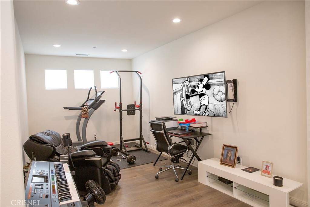 20800 Pine Cone Circle Porter Ranch, CA 91326 - Photo 21 of 43 a view of a room with gym equipment