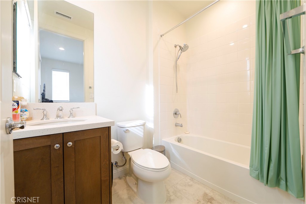 20800 Pine Cone Circle Porter Ranch, CA 91326 - Photo 25 of 43 a bathroom with a sink a toilet and shower