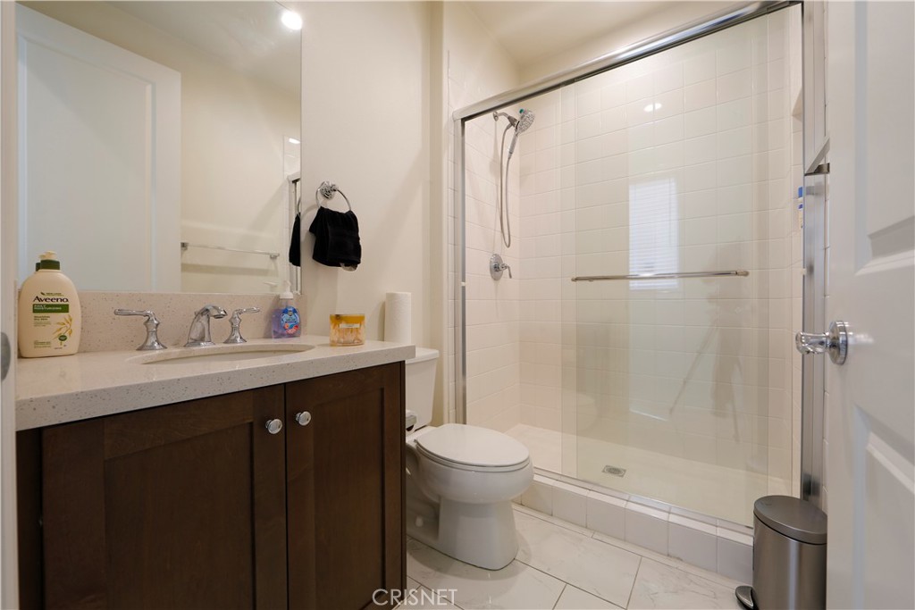 20800 Pine Cone Circle Porter Ranch, CA 91326 - Photo 26 of 43 a bathroom with a sink toilet tub and shower