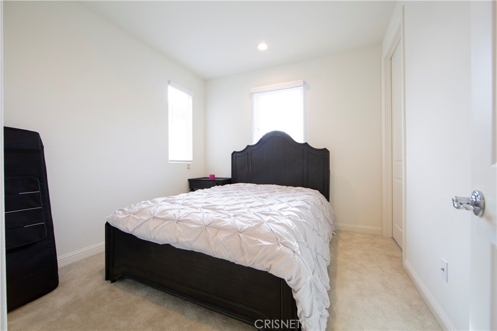 20800 Pine Cone Circle Porter Ranch, CA 91326 - Photo 28 of 43 a bedroom with a bed and a window