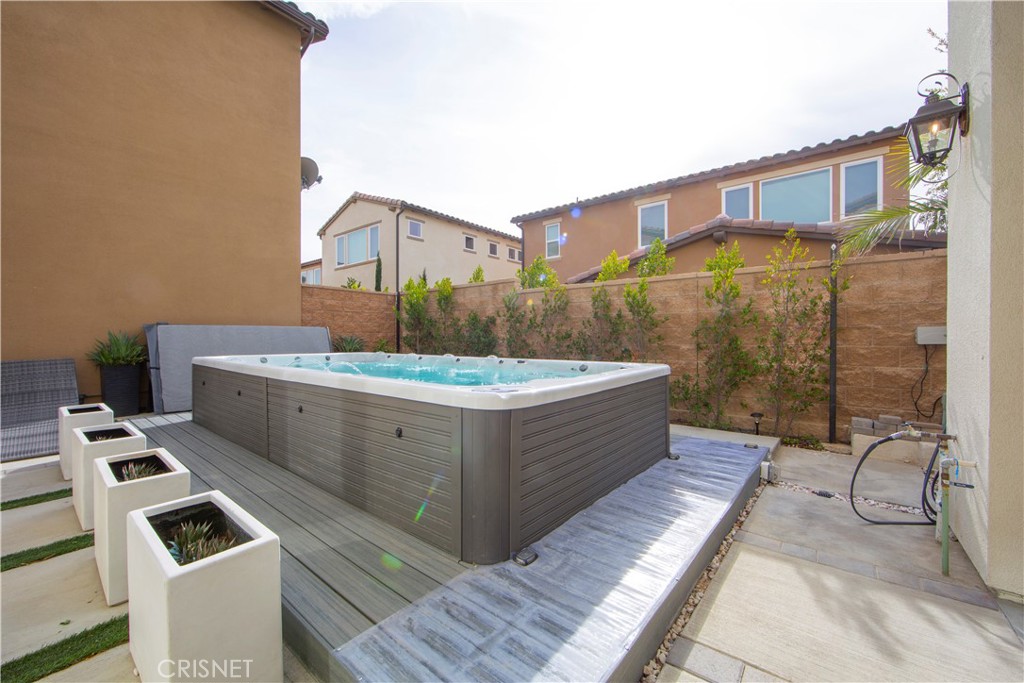 20800 Pine Cone Circle Porter Ranch, CA 91326 - Photo 31 of 43 a bathroom with a bathtub sink and mirror