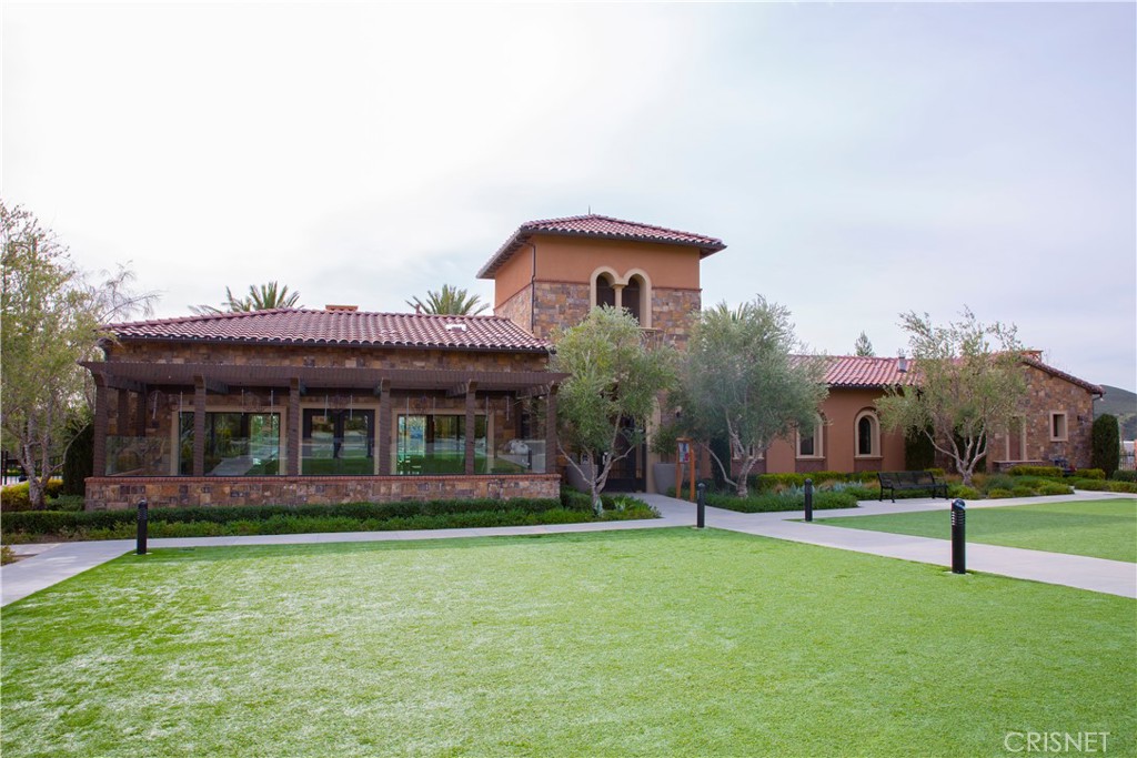 20800 Pine Cone Circle Porter Ranch, CA 91326 - Photo 35 of 43 front view of a house with a yard