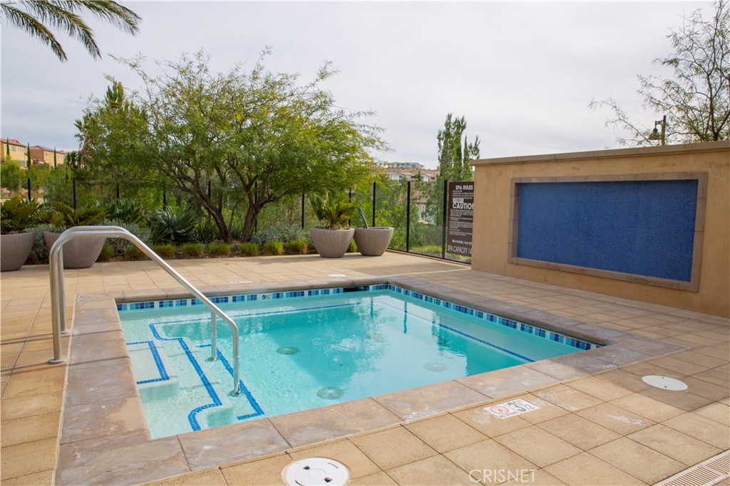 20800 Pine Cone Circle Porter Ranch, CA 91326 - Photo 39 of 43 a view of a swimming pool with a patio