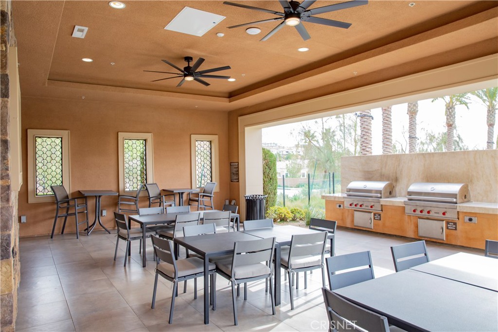 20800 Pine Cone Circle Porter Ranch, CA 91326 - Photo 41 of 43 a dining room with furniture window and wooden floor