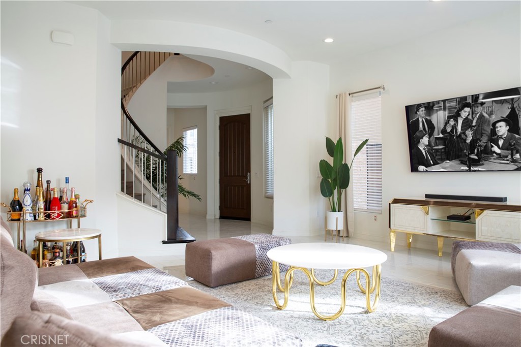 20800 Pine Cone Circle Porter Ranch, CA 91326 - Photo 5 of 43 a living room with furniture and a potted plant