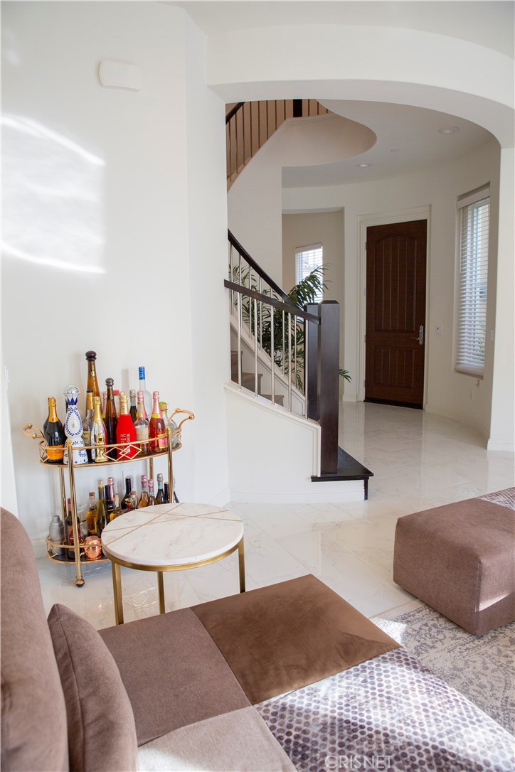 20800 Pine Cone Circle Porter Ranch, CA 91326 - Photo 6 of 43 a bedroom with furniture and a rug