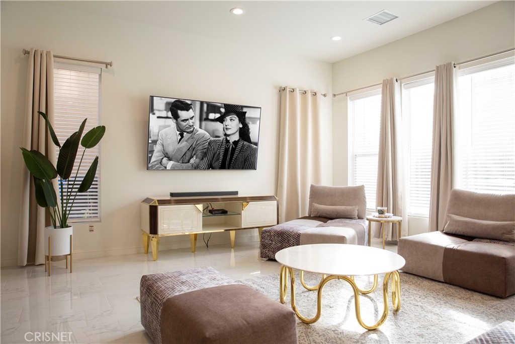 20800 Pine Cone Circle Porter Ranch, CA 91326 - Photo 8 of 43 a living room with furniture and a large window
