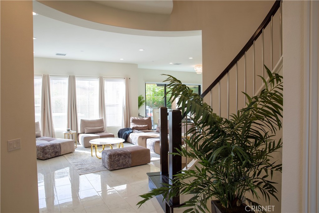 20800 Pine Cone Circle Porter Ranch, CA 91326 - Photo 9 of 43 a living room with furniture and a potted plant