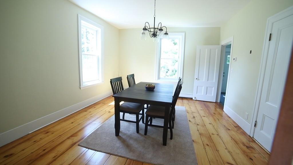 457 Edmands Road Framingham, MA 01701 - Photo 13 of 31 a view of a dining room with furniture and wooden floor