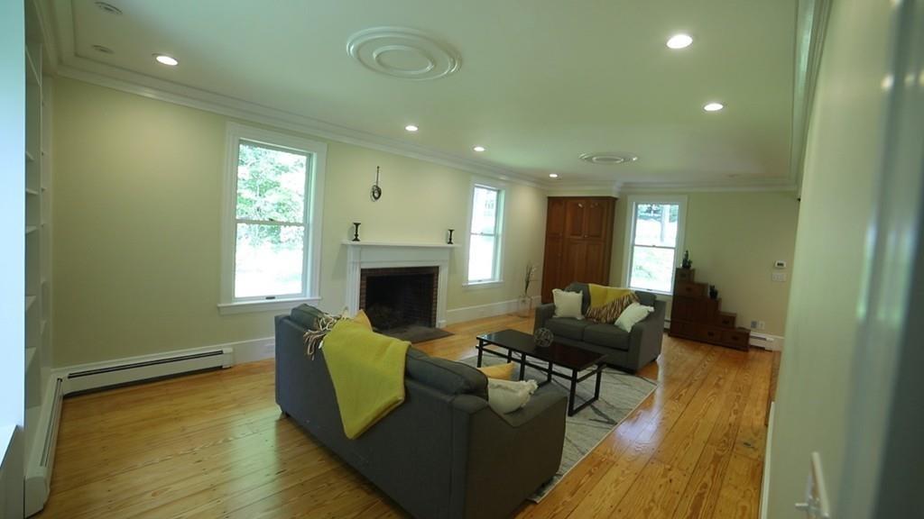457 Edmands Road Framingham, MA 01701 - Photo 16 of 31 a living room with furniture and a fireplace