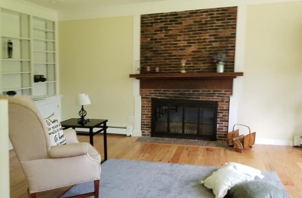 457 Edmands Road Framingham, MA 01701 - Photo 20 of 31 a living room with furniture and a fireplace