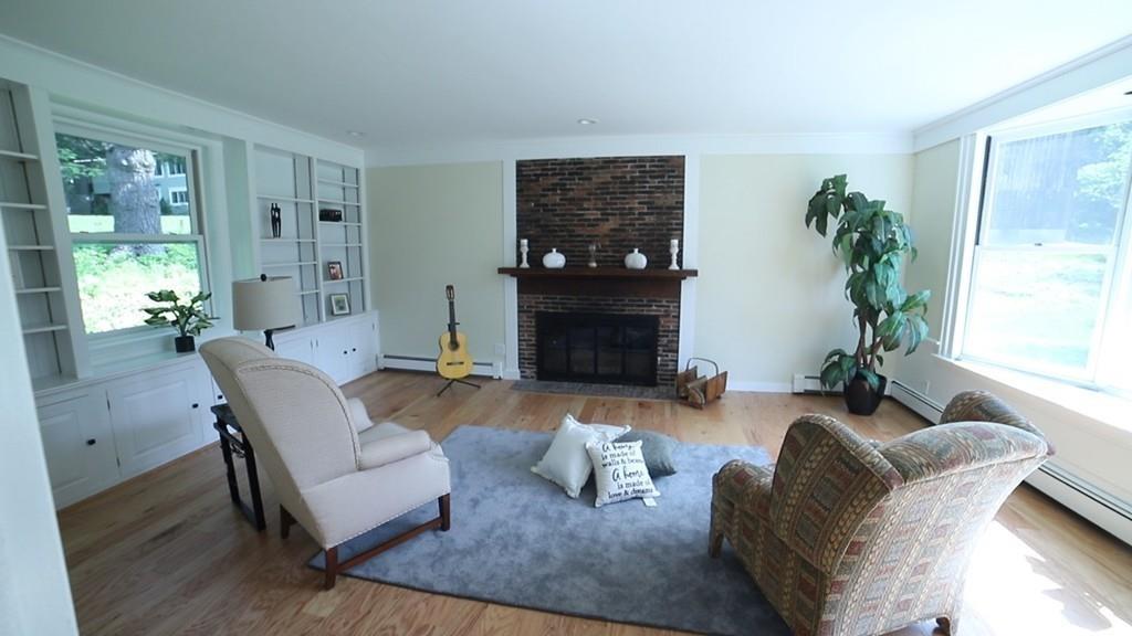 457 Edmands Road Framingham, MA 01701 - Photo 21 of 31 a living room with furniture potted plant and a fireplace
