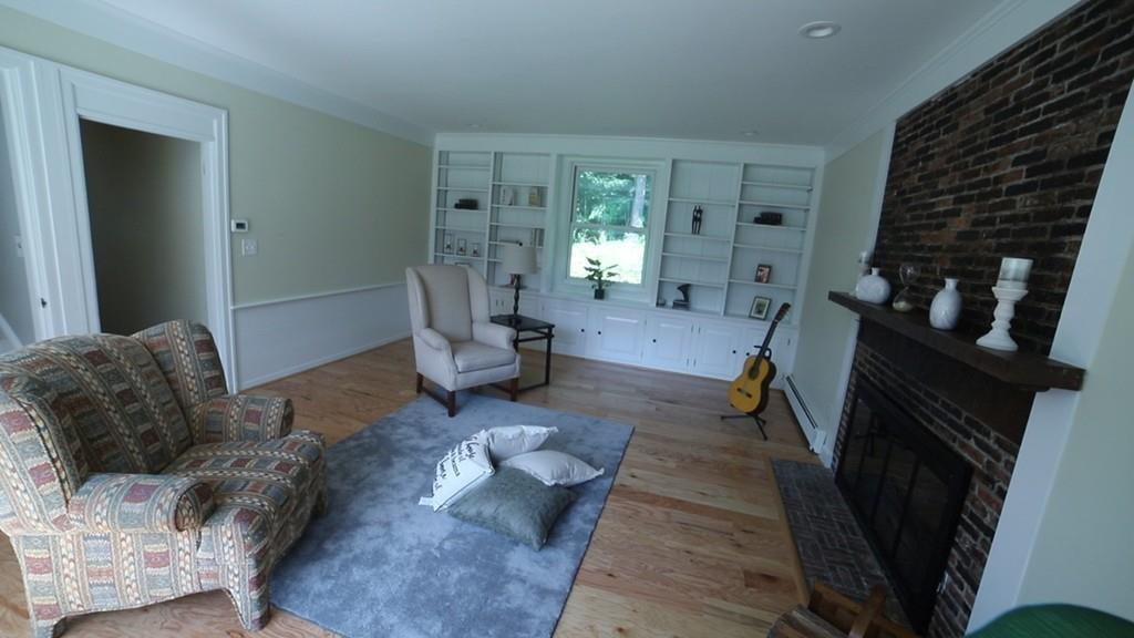 457 Edmands Road Framingham, MA 01701 - Photo 22 of 31 a living room with furniture and a fireplace