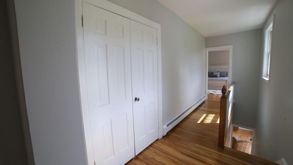 457 Edmands Road Framingham, MA 01701 - Photo 23 of 31 a view of a hallway with wooden floor and staircase