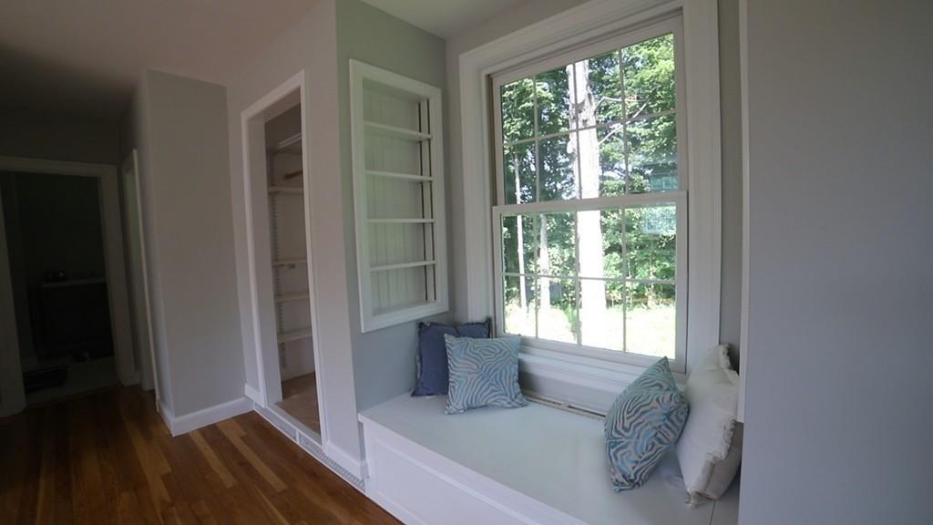 457 Edmands Road Framingham, MA 01701 - Photo 25 of 31 a living room with furniture and a floor to ceiling window