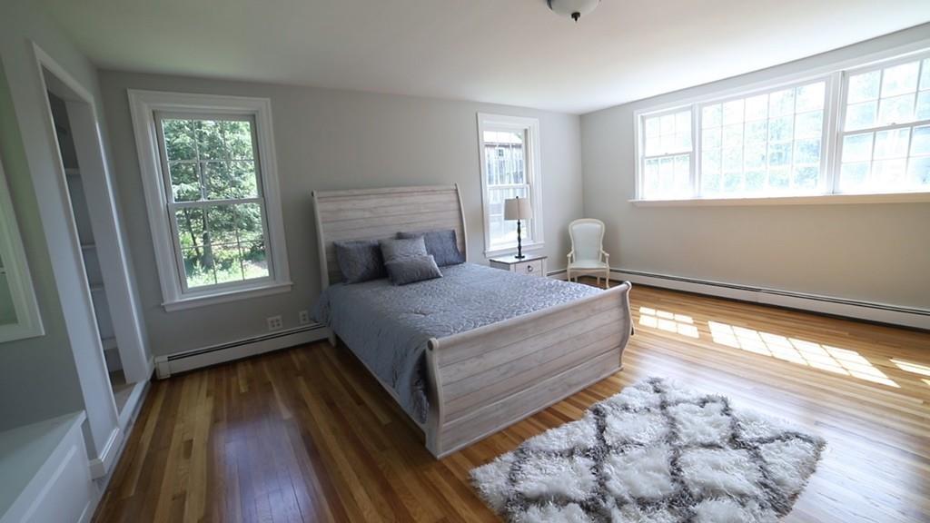 457 Edmands Road Framingham, MA 01701 - Photo 27 of 31 a bedroom with a bed and wooden floor