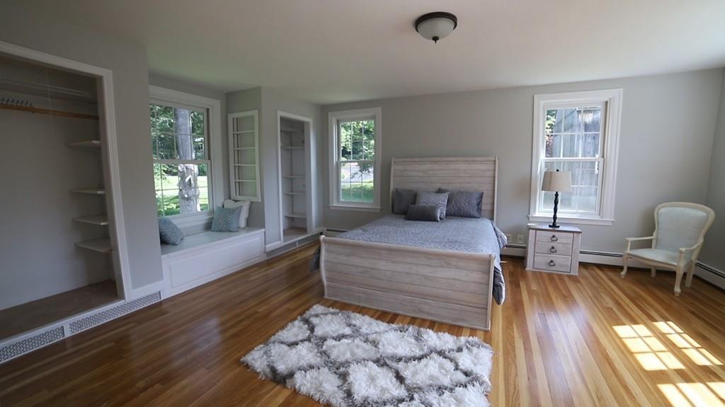 457 Edmands Road Framingham, MA 01701 - Photo 28 of 31 a bedroom with a bed and wooden floor