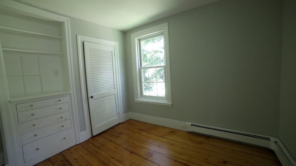 457 Edmands Road Framingham, MA 01701 - Photo 29 of 31 a view of an empty room with wooden floor and a window