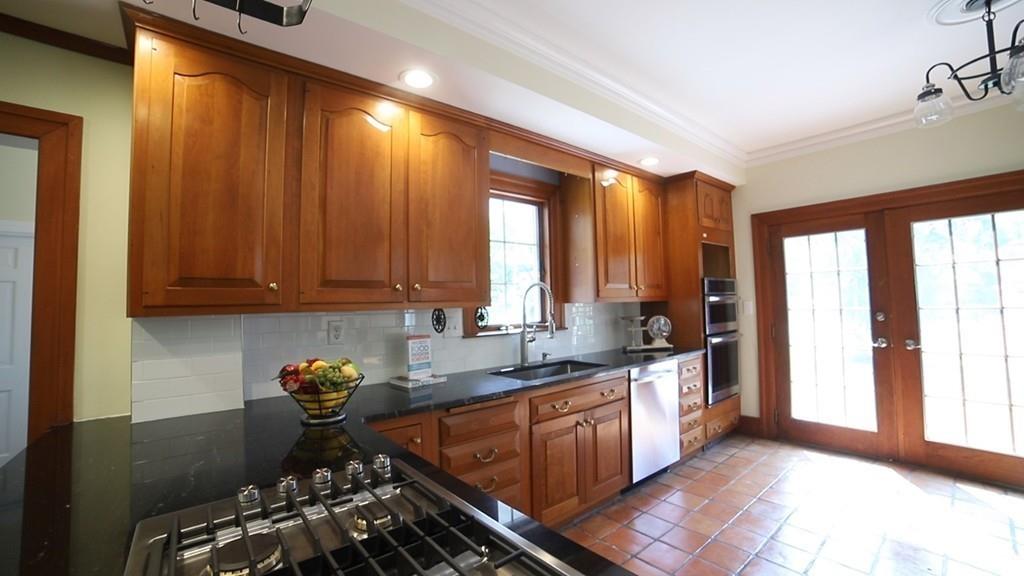457 Edmands Road Framingham, MA 01701 - Photo 10 of 31 a kitchen with a sink a stove and cabinets