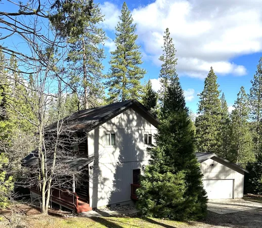 a view of a house with a tree