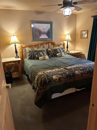 a bedroom with a bed and a lamp