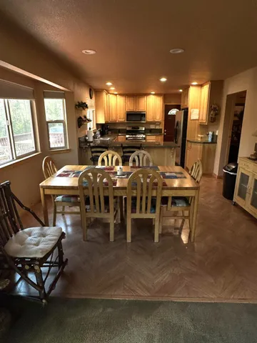 a view of a dining room with furniture